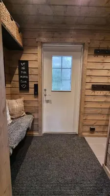 a door in a room with a bed and a window at Alpinvegen 22B, Trysil Alpin 22B in Trysil