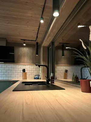 a kitchen with a counter with a sink in it at Snowcake Cottage in Sør-Fron