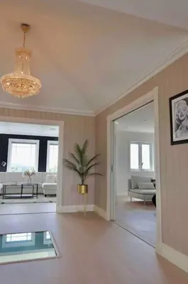 a large living room with a potted plant in it at Villa Freya with stunning sea view in Kristiansund