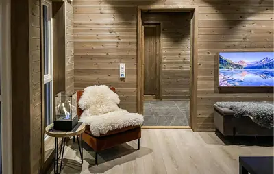 a living room with a couch and a tv at Cozy Home In Ålen With Wifi in Ålen