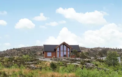 a house on top of a hill at Awesome Home In Sveio in Sveio