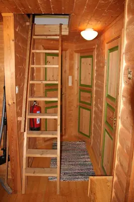 a room in a log cabin with a ladder at Fjordhytte-40 im Vestland - Hordaland nahe Rosendal in Rosendal