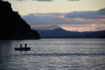 two people on a boat in the water at Fjordhytte-5 Hardanger-Region, zwischen Odda und Rosendal in Sundal