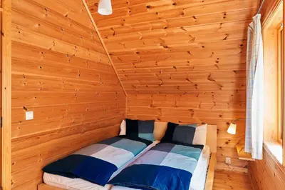 a small room with two beds in a cabin at Fjordhytte-5 Hardanger-Region, zwischen Odda und Rosendal in Sundal