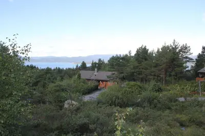 a house on a hill with a road leading to it at Fjordhytte-38 bei Rosendal am Hardangerfjord in Rosendal