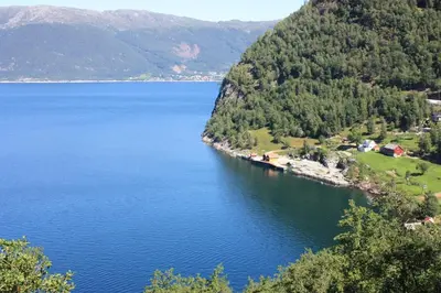 a view of a large body of water at Fjordhytte-23 direkt am Sognefjord, mit mietbaren Motorbooten 9,9-60 PS in Bjordal