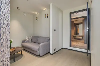 a living room with a couch and a mirror at Nordnes Brygge in Bergen