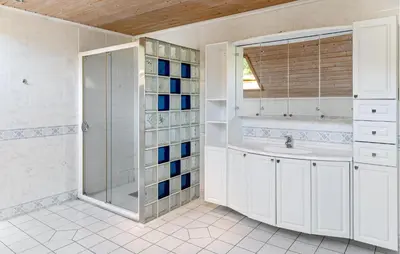 a bathroom with a shower and a sink at Doktorgarden in Selje