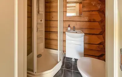 a bathroom with a shower and a toilet and a sink at Beautiful Home In Øyer With Wifi in Øyer