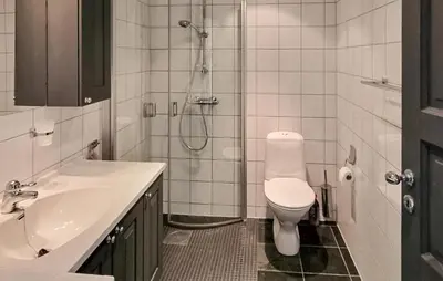 a bathroom with a toilet and a shower and a sink at 2 Bedroom Stunning Home In Geilo in Geilo