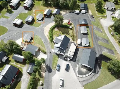 an aerial view of a parking lot with houses at Geilo Hytter & Camping in Geilo