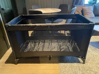 a black bed frame in a living room at Cozy cabin with a view in Kvamseter