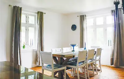 a dining room with a table and chairs at 4 Bedroom Nice Home In Eidfjord in Eidfjord