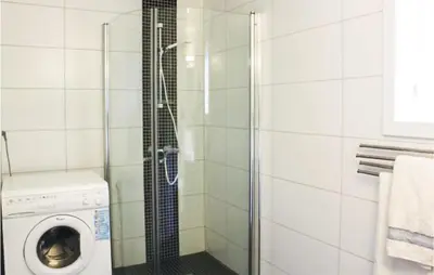 a shower with a washing machine in a bathroom at 4 Bedroom Nice Home In Eidfjord in Eidfjord