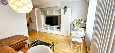 a living room with a couch and a television at Dreggsalmenning 20 in Bergen