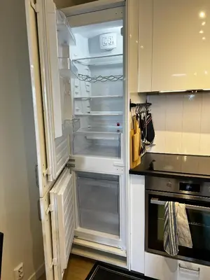 a refrigerator with its door open in a kitchen at Apartment Lagunen with Terrace, Grill and Free Parking in Bergen