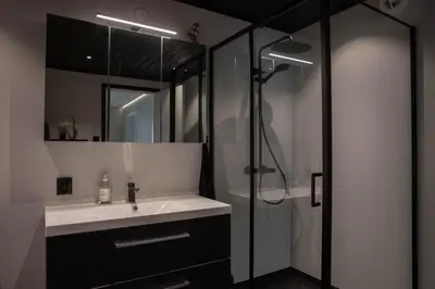 a bathroom with a sink and a shower at Huset på Plassen in Sogndal