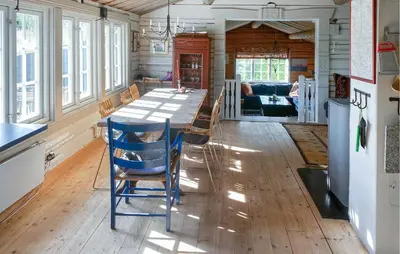 a kitchen with a table and chairs in a room at Awesome Home In Aurdal With Sauna in Aurdal