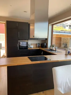 a kitchen with a sink and a counter top at Voss Resort self-catered apartments in Skulestadmo