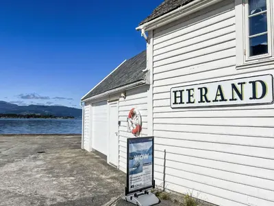 a sign on the side of a building at Holiday Home Blå Hytte by Interhome in Herand
