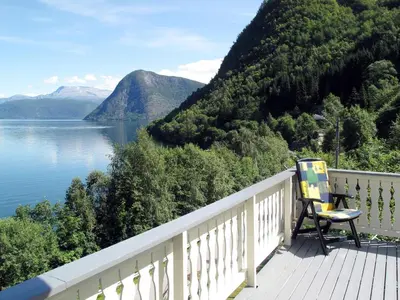 a deck with a view of a lake and mountains at Holiday Home Hovsfjellet by Interhome in Fresvik
