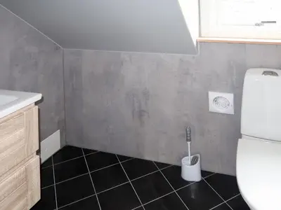 a small bathroom with a toilet and a sink at Holiday Home Greenhouse by Interhome in Onarheim