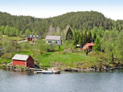 a group of houses on an island in the water at Holiday Home Nystølen by Interhome in Håvik