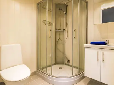 a bathroom with a shower and a toilet at Holiday Home Laksevågen by Interhome in Bruntveit