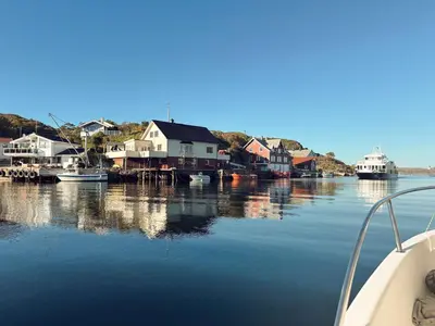 a harbor with houses and boats on the water at Holiday Home Nesjaholmen by Interhome in Kalavåg