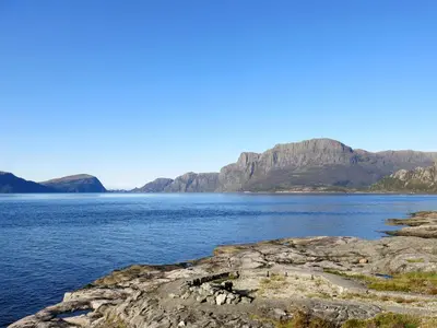 a large body of water with mountains in the background at Holiday Home Nesjevik by Interhome in Bø