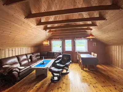a living room with a couch and a table at Holiday Home Naustet by Interhome in Sylte