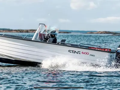a white speed boat on the water at Holiday Home Lange by Interhome in Bømlo
