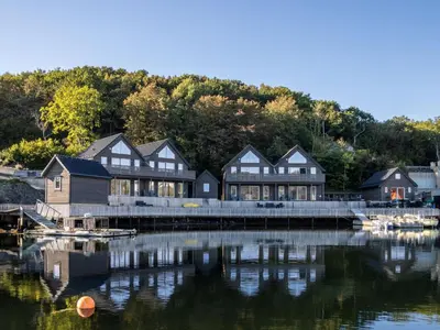 a row of houses on a dock next to the water at Holiday Home Lange by Interhome in Bømlo