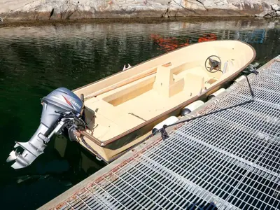a boat is tied to a dock in the water at Holiday Home Krokeggi by Interhome in Arnefjord