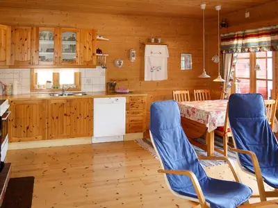 a kitchen with a table and chairs in a room at Holiday Home Krokeggi by Interhome in Arnefjord