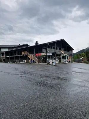 an empty parking lot in front of a building at Haukeli hotell leilighet in Haukeligrend