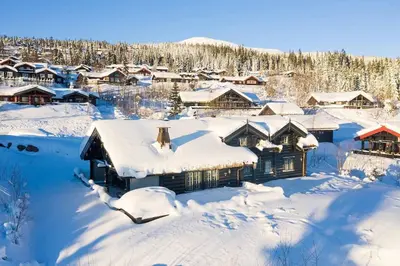 a village covered in snow with houses at Storsten 695 - Trysil in Trysil
