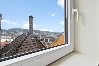a window with a view of a city at Luxury Suite in Charming Area in Bergen