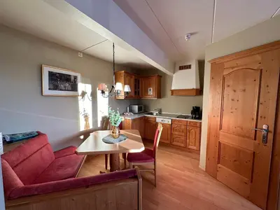 a living room with a red couch and a table at Family-Friendly Apartment Close To Nature in Beitostøl