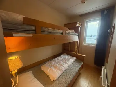 a room with two bunk beds and a window at Family-Friendly Apartment Close To Nature in Beitostøl