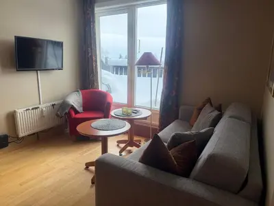 a living room with a couch and a chair at Family-Friendly Apartment Close To Nature in Beitostøl