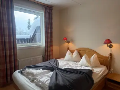 a bed in a room with a window at Family-Friendly Apartment Close To Nature in Beitostøl