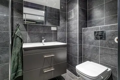 a bathroom with a toilet and a sink at Mountain appartment in Sjusjøen