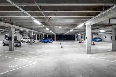 an empty parking garage with cars parked in it at Mountain appartment in Sjusjøen