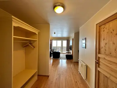 an empty room with a closet and a door at Family-Friendly Apartment Steps From Everything in Beitostøl