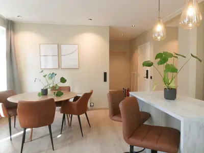 a dining room with a table and chairs at Celestial Bergen Central Apartment in Bergen
