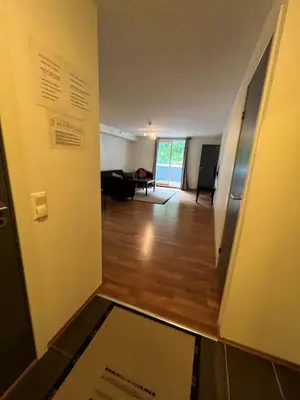 a room with a hallway with a door and a living room at Voss-Oppheim Resort appartment witc acess to swimmingpool in Øyjordi