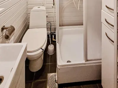 a small bathroom with a toilet and a sink at 6 person holiday home in Flatanger in Lauvsnes