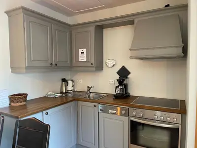 a kitchen with white cabinets and a sink at Small Family Retreat Two Bedrooms And Easy Access in Beitostøl