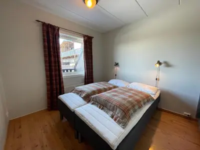 a bedroom with a bed and a window at Small Family Retreat Two Bedrooms And Easy Access in Beitostøl